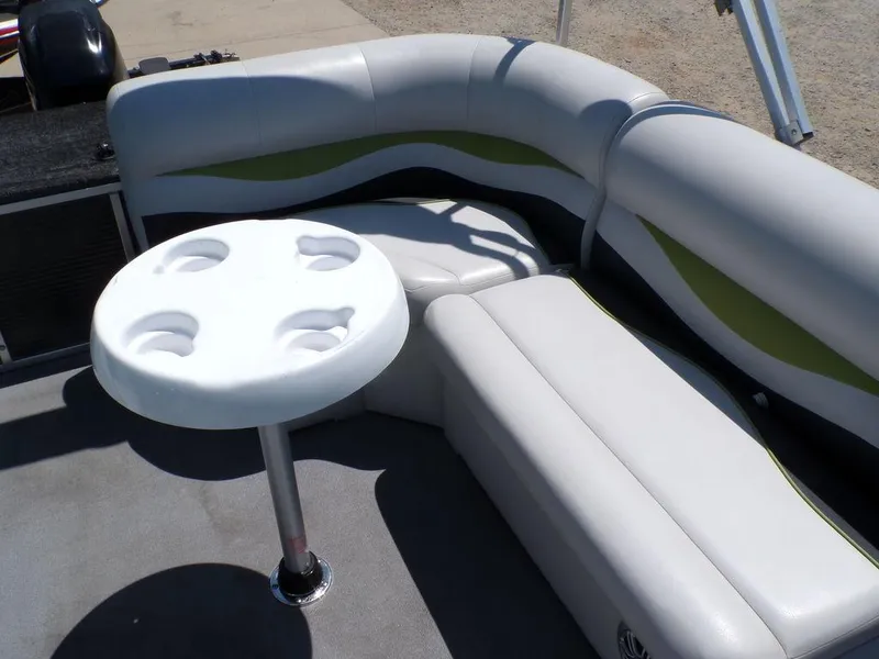 Slide: The Image of 2020 Qwest Edge 816 Cruise boat interior with cushioned seating and round table. - 19
