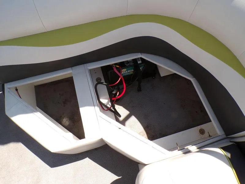 Slide: The Image of 2020 Qwest Edge 816 Cruise boat battery compartment with wiring and storage space. - 20