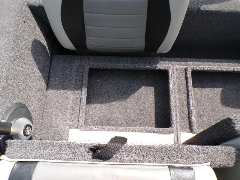 Slide: The Image of 2014 Lowe Stinger ST195 boat interior with storage compartments and seating. - 22