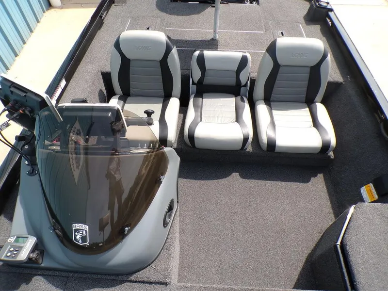 Slide: The Image of 2014 Lowe Stinger ST195 boat interior with three gray and black seats. - 23
