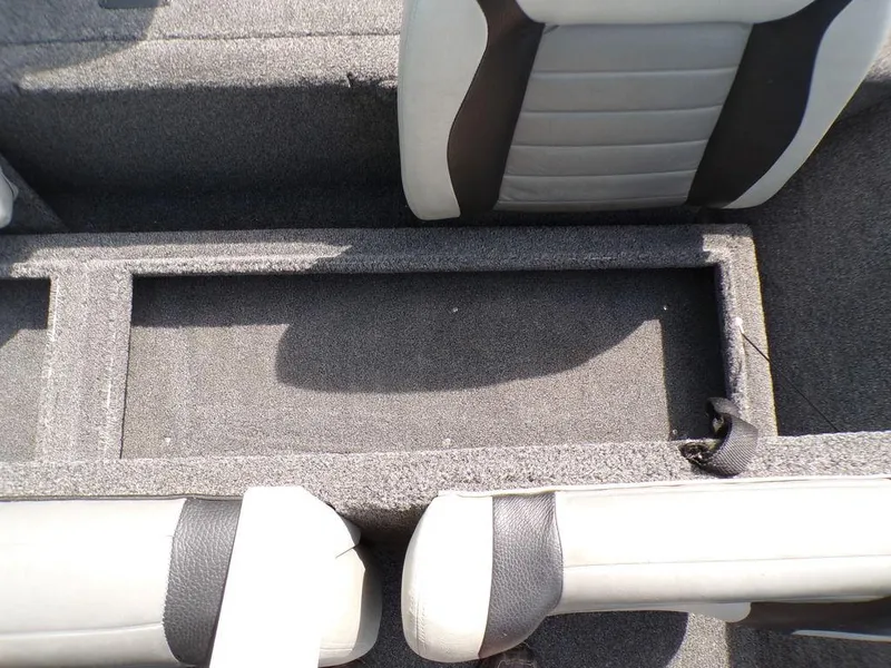 Slide: The Image of Interior view of a 2014 Lowe Stinger ST195 boat, featuring gray carpeted seating. - 24