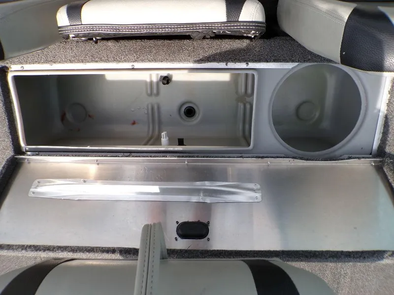 Slide: The Image of 2014 Lowe Stinger ST195 boat storage compartment with open lid, showcasing interior space. - 25