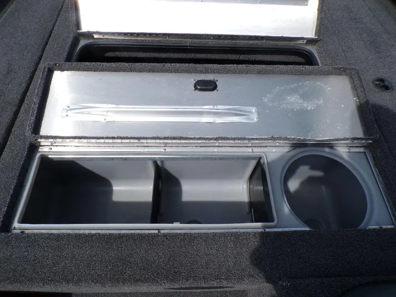Slide: The Image of 2014 Lowe Stinger ST195 boat storage compartment with open lid, showcasing interior space. - 27