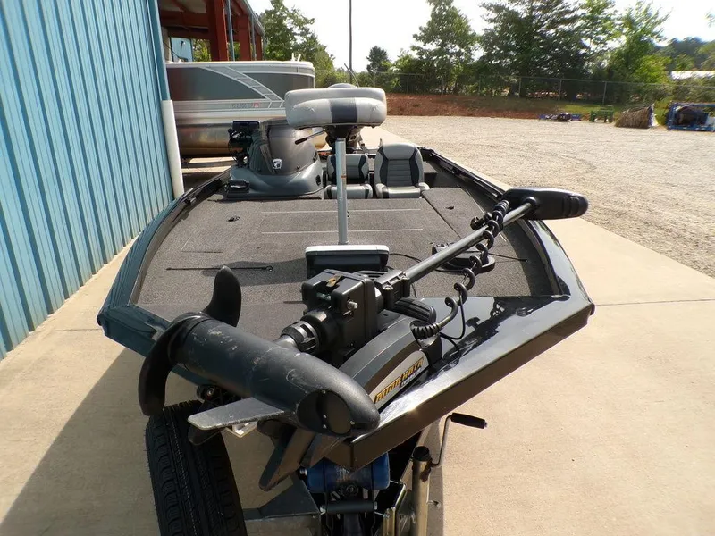 Slide: The Image of 2014 Lowe Stinger ST195 boat with trolling motor, parked outdoors on concrete. - 5