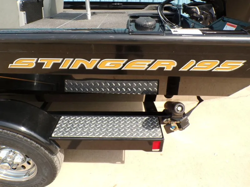Slide: The Image of 2014 Lowe Stinger ST195 boat with diamond plate steps and bold lettering. - 6