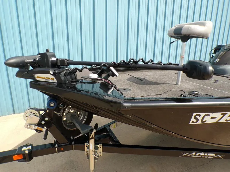Slide: The Image of 2014 Lowe Stinger ST195 boat with trolling motor, parked on trailer. - 9