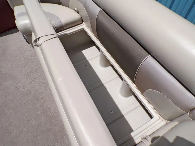 Slide: The Image of 2013 JC Limited 221 Triple boat seat storage compartment, open and empty. - 11