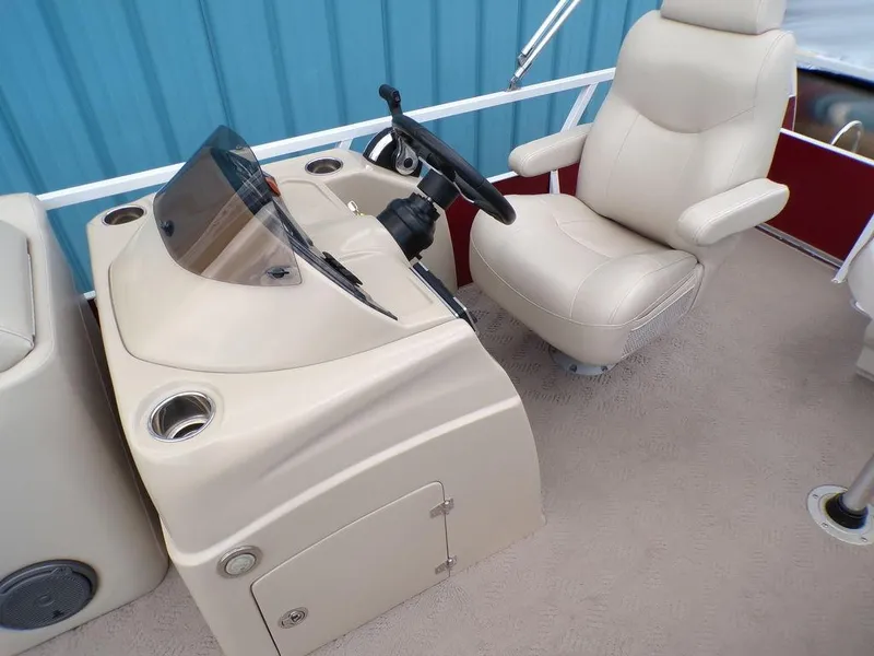 Slide: The Image of 2013 JC Limited 221 Triple boat helm with beige captain's chair and steering console. - 15