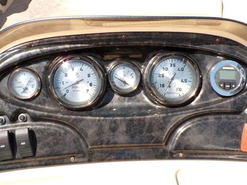 Slide: The Image of Dashboard of 2013 JC Limited 221 Triple boat with gauges and controls. - 18