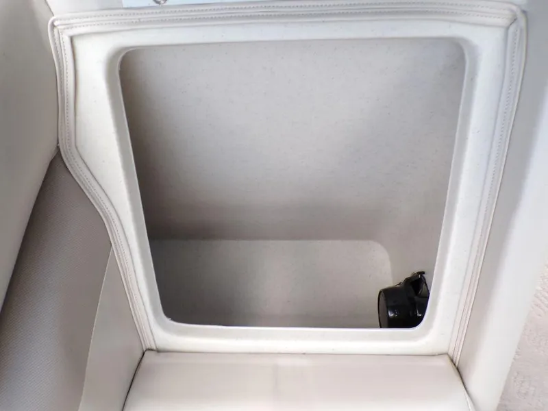 Slide: The Image of Storage compartment in a 2013 JC Limited 221 Triple boat interior. - 23