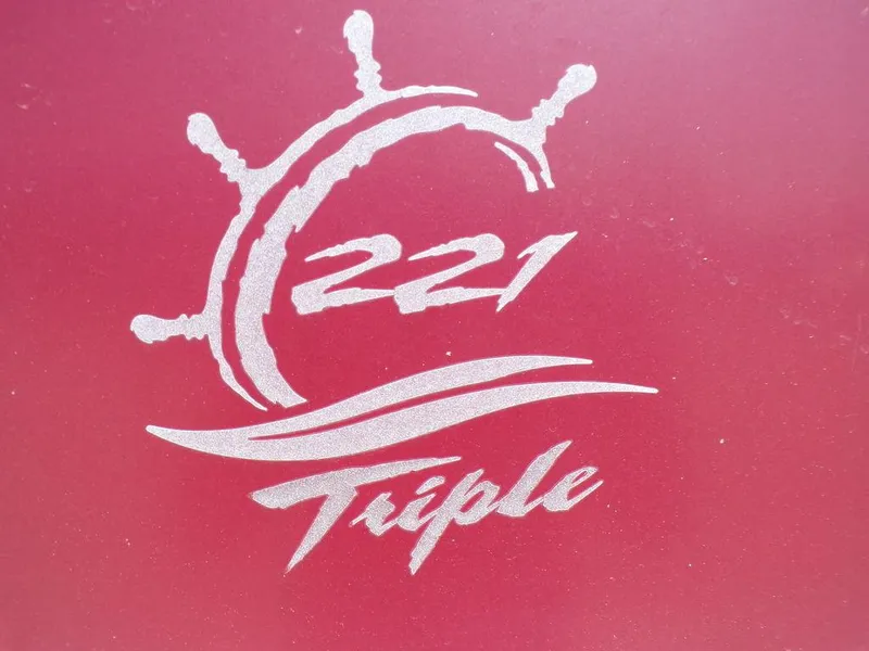 Slide: The Image of JC Limited 221 Triple logo on red background, 2013 model. - 7