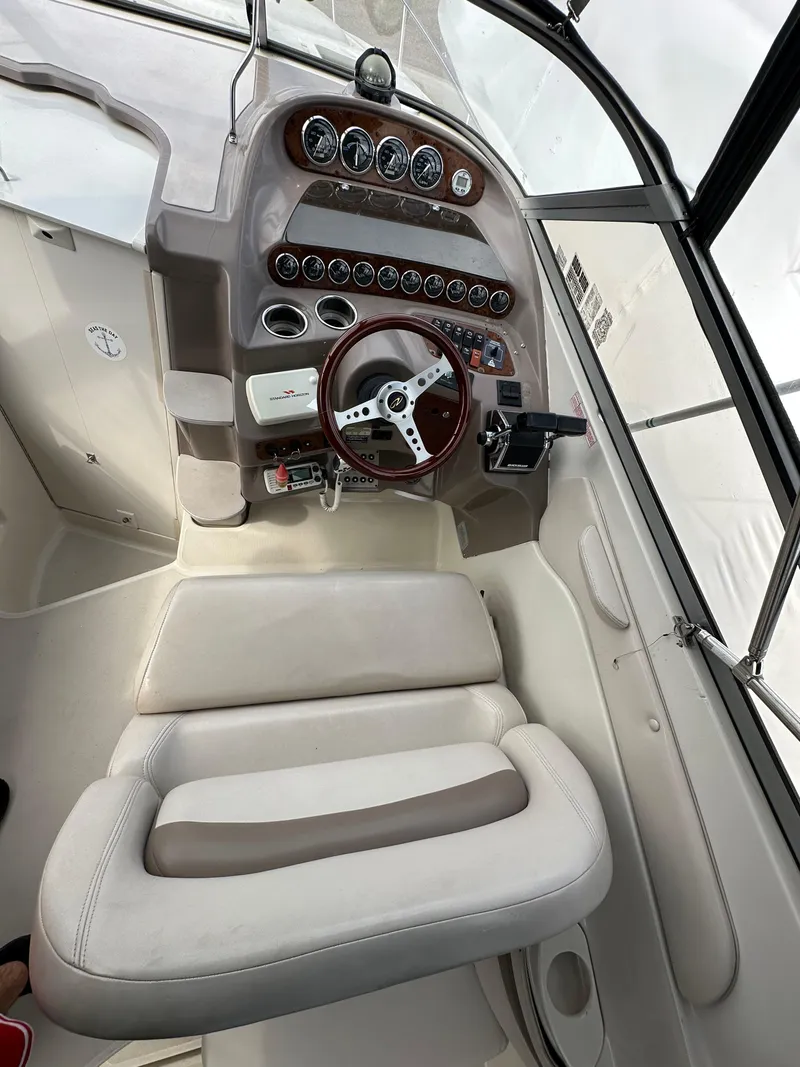 Slide: The Image of 1998 Regal 2760 Commodore boat cockpit with steering wheel and instrument panel. - 10