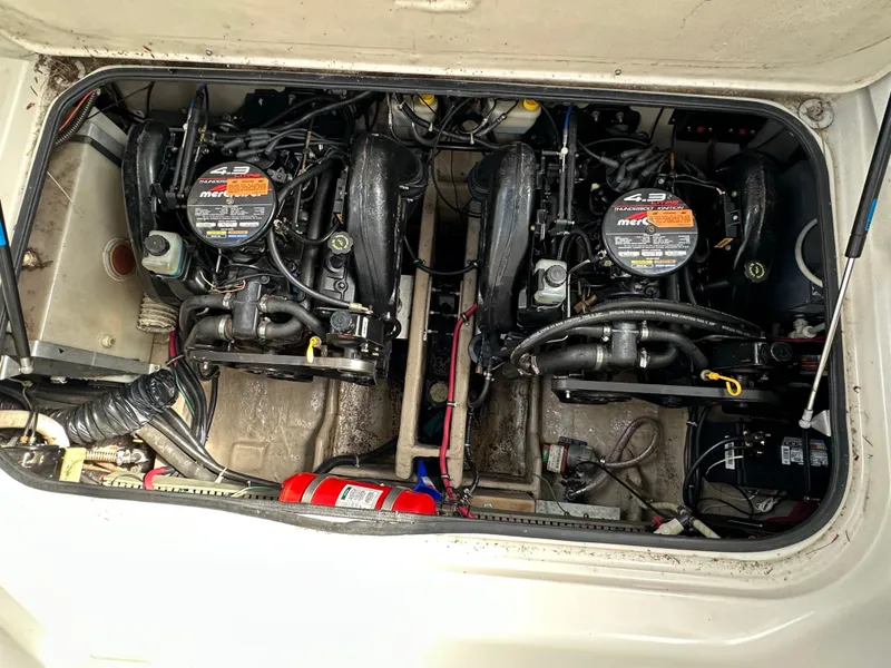 Slide: The Image of Engine compartment of a 1998 Regal 2760 Commodore boat with dual MerCruiser engines. - 19