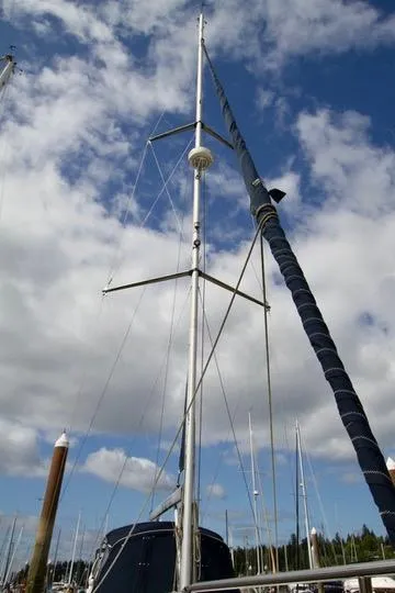 Slide: The Image of Sailboat mast of 2001 Hunter Passage 420 against a cloudy sky. - 10