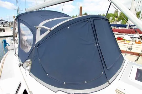 Slide: The Image of 2001 Hunter Passage 420 sailboat with blue canvas cockpit cover in marina. - 14
