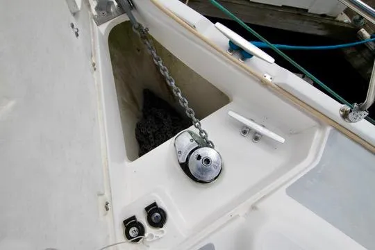 Slide: The Image of Anchor chain and winch on 2001 Hunter Passage 420 sailboat deck. - 20