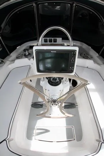 Slide: The Image of 2001 Hunter Passage 420 yacht cockpit with navigation equipment and steering wheel. - 21