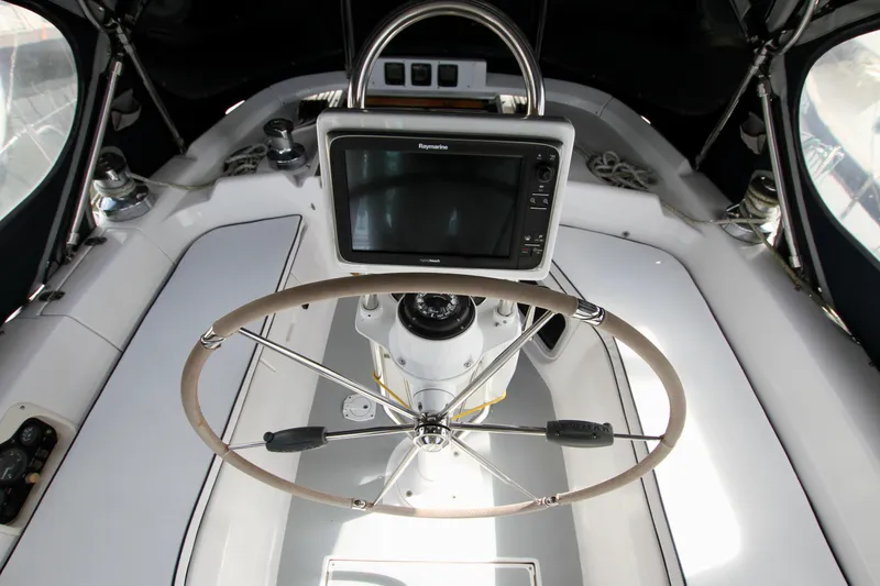 Slide: The Image of Steering wheel and navigation system on 2001 Hunter Passage 420 yacht. - 22