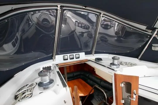 Slide: The Image of Interior view of 2001 Hunter Passage 420 sailboat cockpit with seating and navigation equipment. - 25