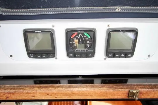 Slide: The Image of Instrument panel of 2001 Hunter Passage 420 sailboat with navigation displays. - 26
