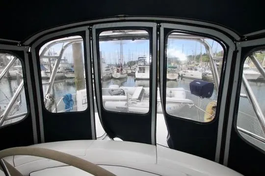 Slide: The Image of Interior view of 2001 Hunter Passage 420 sailboat with marina backdrop. - 31