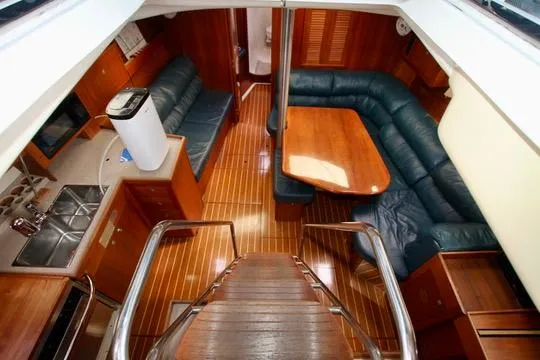 Slide: The Image of Interior of 2001 Hunter Passage 420 yacht with wooden flooring and seating area. - 34