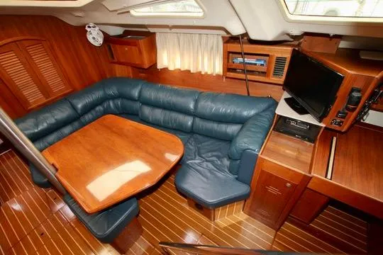Slide: The Image of Interior of 2001 Hunter Passage 420 yacht with wood finish and blue seating. - 37