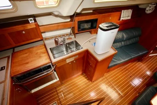 Slide: The Image of Interior of 2001 Hunter Passage 420 yacht with wooden cabinetry and modern amenities. - 40