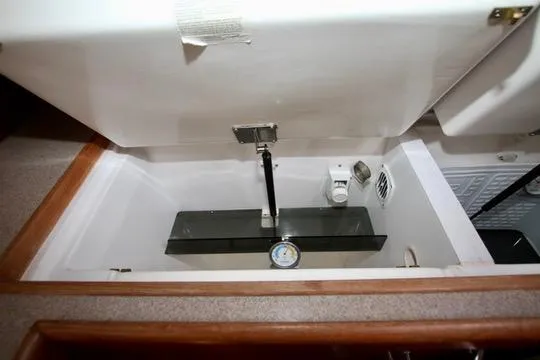 Slide: The Image of Interior view of a 2001 Hunter Passage 420 yacht compartment with storage space. - 44