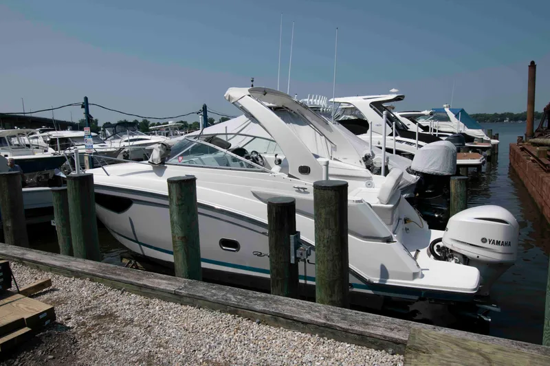 Slide: The Image of 2020 Regal 26 XO boat docked at a marina with Yamaha outboard motor. - 0