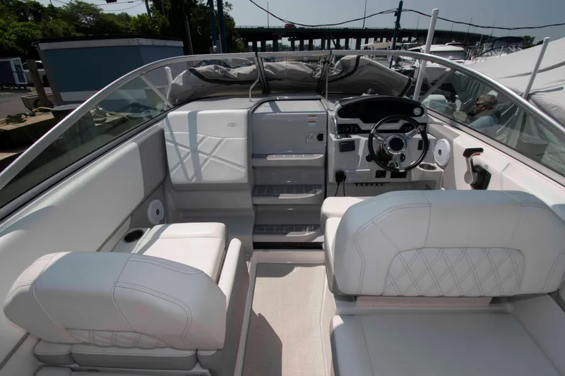Slide: The Image of 2020 Regal 26 XO boat interior with white seating and modern dashboard. - 3