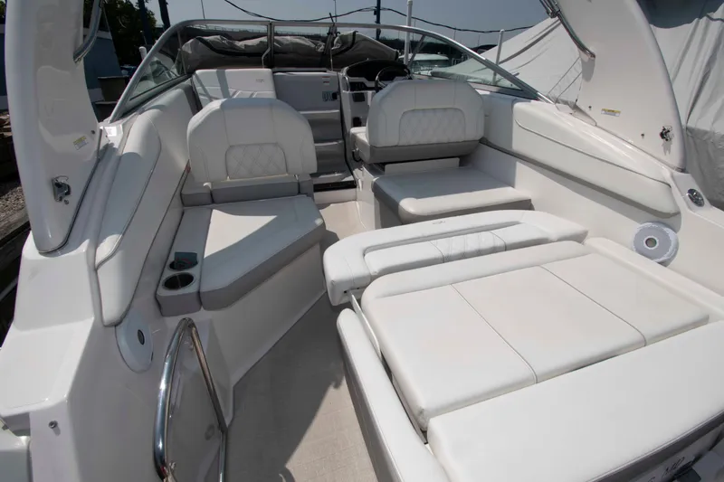 Slide: The Image of 2020 Regal 26 XO boat interior with white seating and modern design. - 9