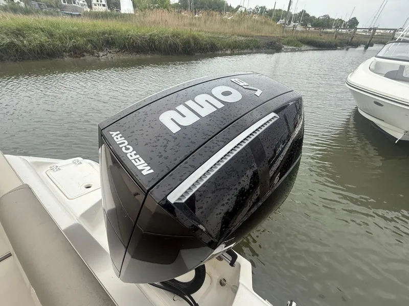 Slide: The Image of 2024 Key West 239 FS boat with Mercury outboard engine on water. - 12