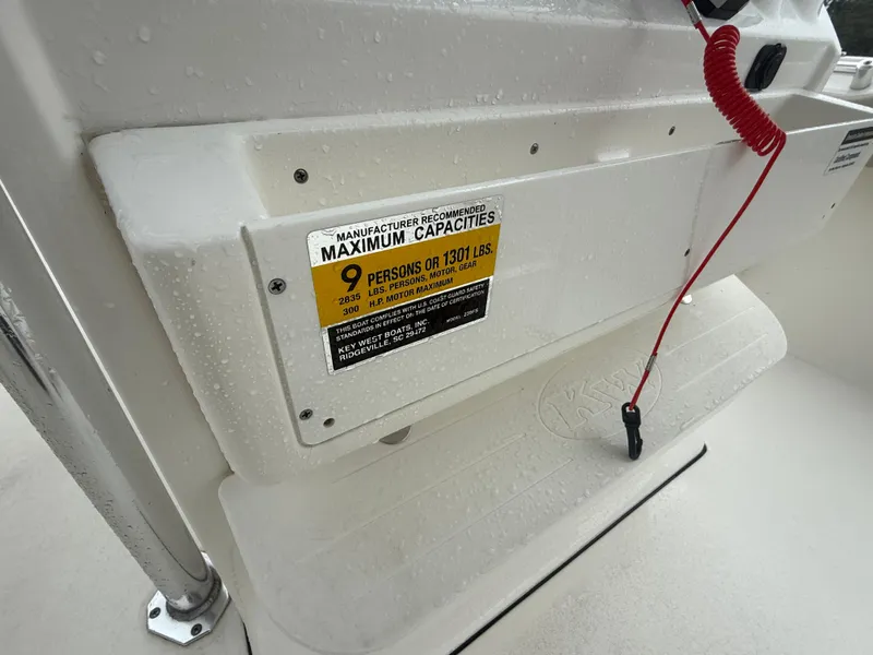 Slide: The Image of 2024 Key West 239 FS boat capacity label, showing maximum of 9 persons or 1301 lbs. - 13