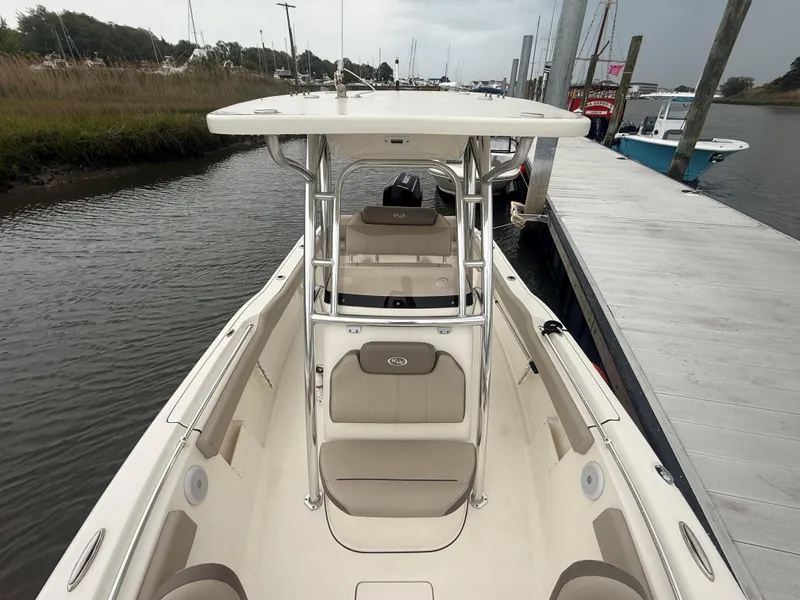 Slide: The Image of 2024 Key West 239 FS boat docked by a calm riverbank. - 16