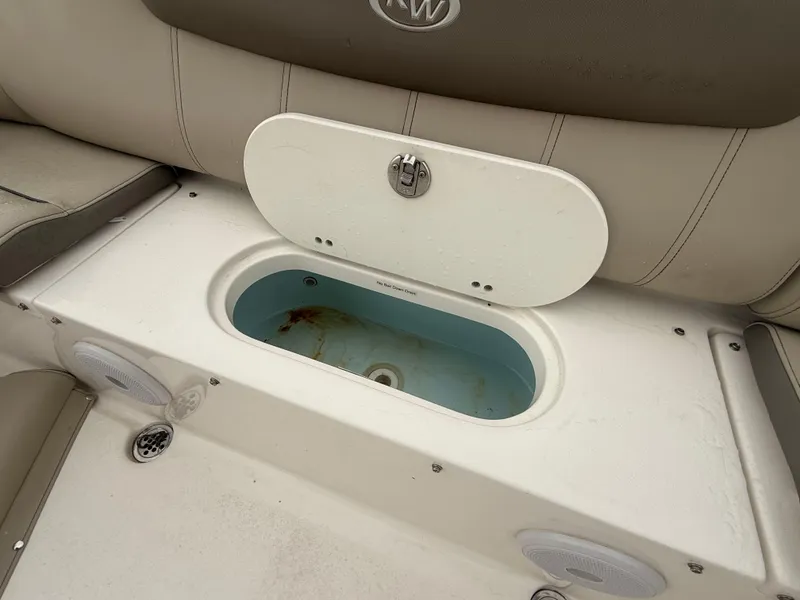 Slide: The Image of Livewell on 2024 Key West 239 FS boat, featuring integrated seating and storage. - 17