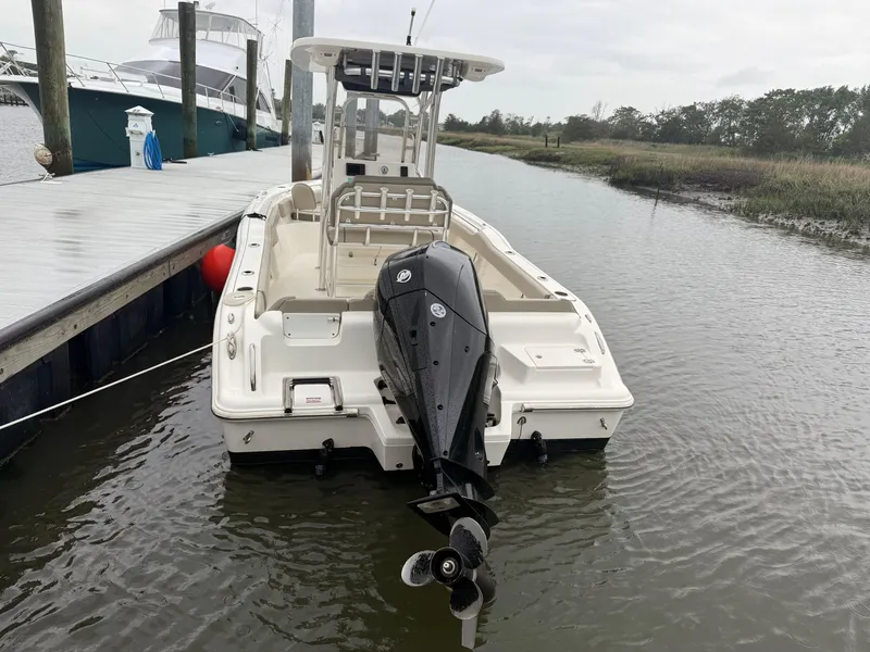 Slide: The Image of 2024 Key West 239 FS boat docked in calm waters, rear view. - 20
