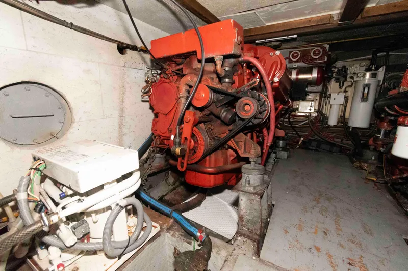 Slide: The Image of Engine room of a 1988 Marine Trader 48 Trawler with visible machinery and components. - 27