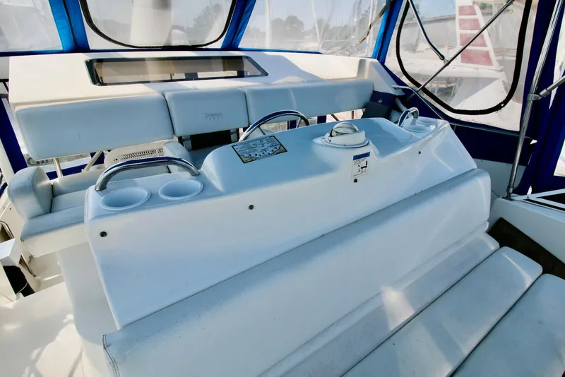 Slide: The Image of 1997 Silverton 372 Motor Yacht interior with helm and seating area. - 14