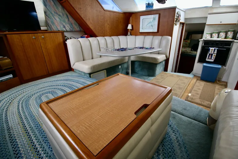 Slide: The Image of Interior of a 1997 Silverton 372 Motor Yacht with dining area and kitchen. - 23