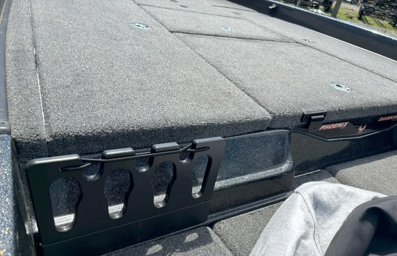 Slide: The Image of 2019 Phoenix 920 PRO XP boat deck with carpeted surface and rod holders. - 16