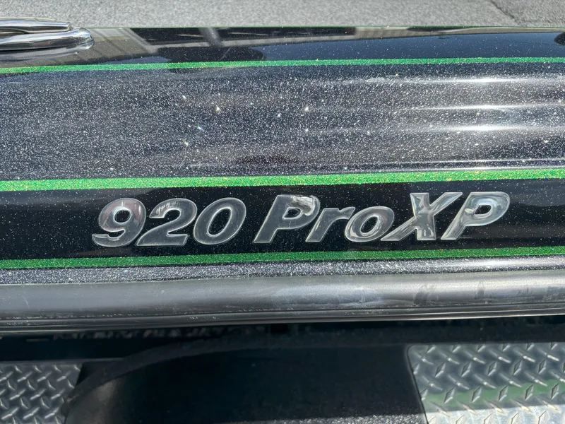 Slide: The Image of 2019 Phoenix 920 PRO XP boat with metallic finish and green accents. - 8