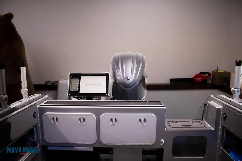 Slide: The Image of 2023 Extreme Boats 745 Game King dashboard with Garmin display and controls. - 16