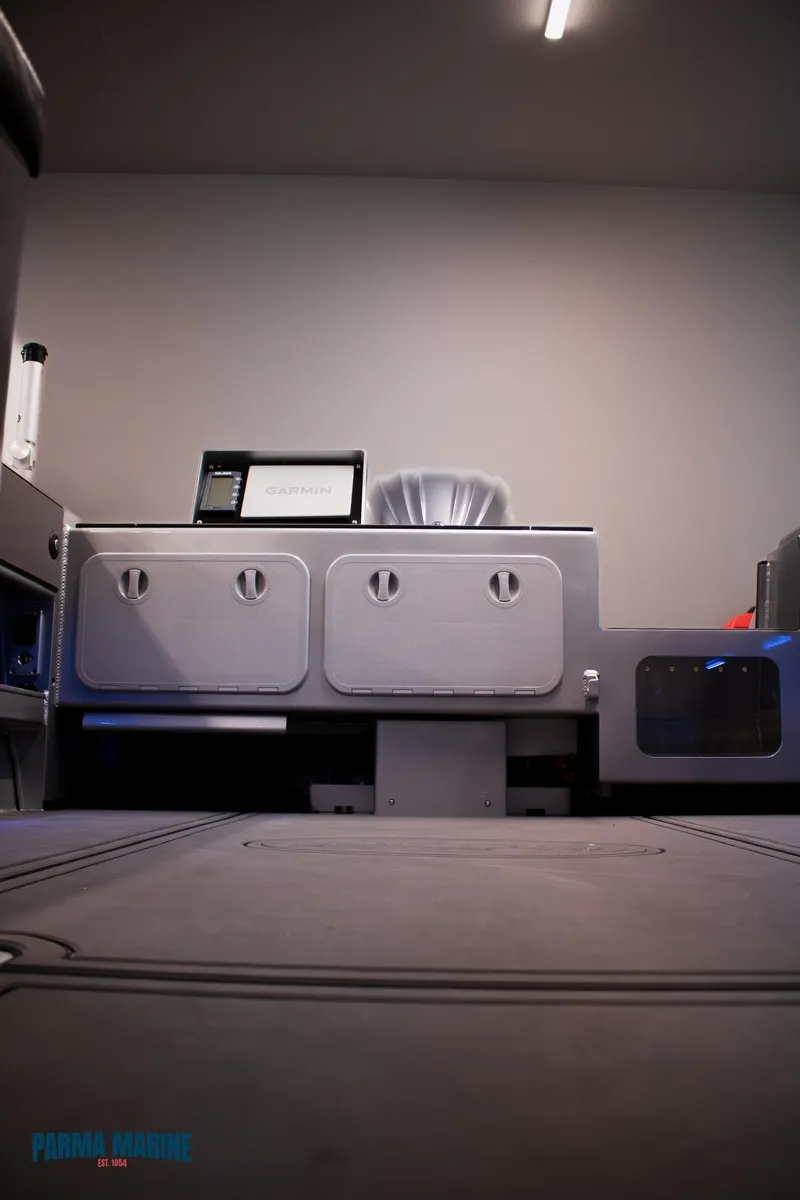 Slide: The Image of 2023 Extreme Boats 745 Game King interior with modern control panel and storage compartments. - 21