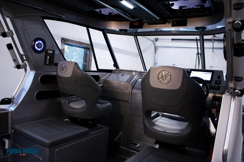 Slide: The Image of Interior of 2023 Extreme Boats 745 Game King, featuring modern seating and dashboard. - 22