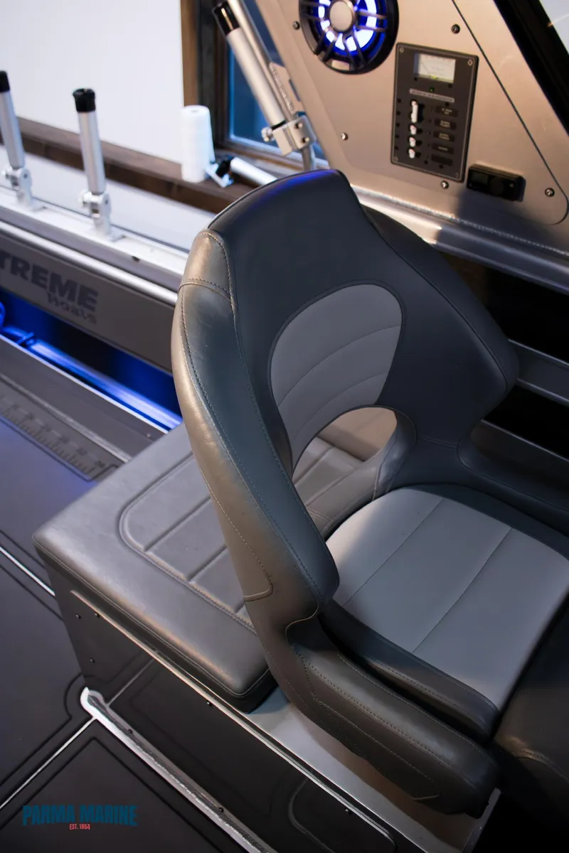 Slide: The Image of 2023 Extreme Boats 745 Game King interior with sleek seating and modern controls. - 25