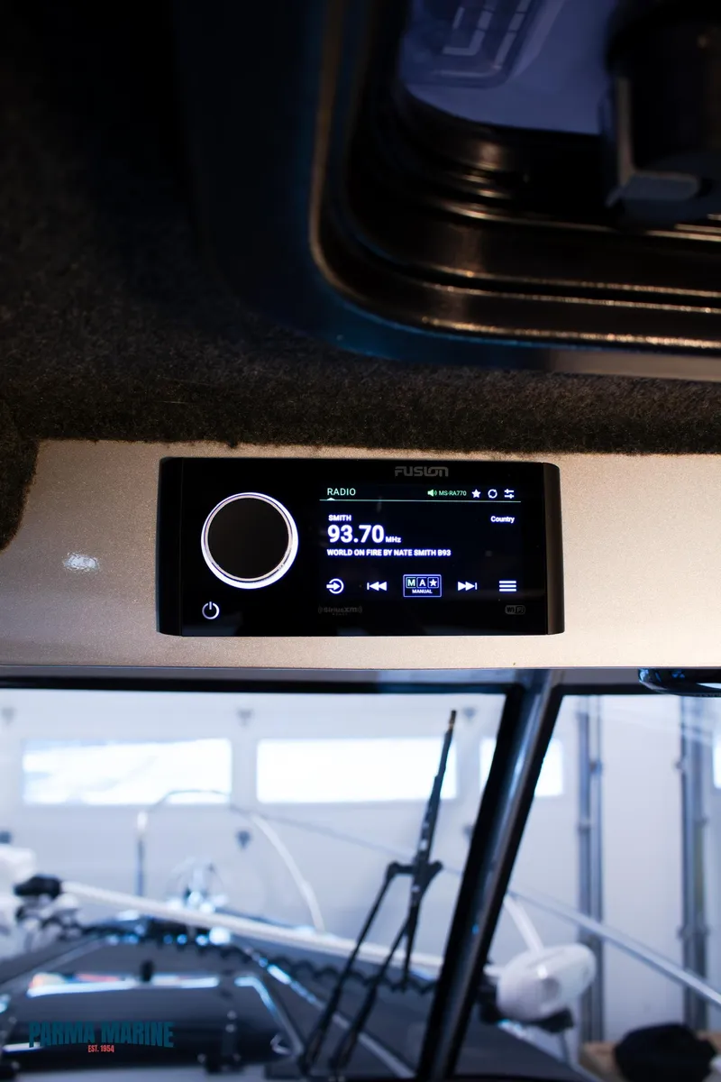 Slide: The Image of 2023 Extreme Boats 745 Game King interior with Fusion marine stereo system. - 29