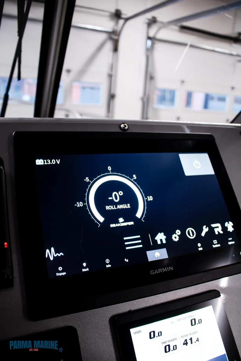 Slide: The Image of 2023 Extreme Boats 745 Game King dashboard with Garmin display showing roll angle. - 32