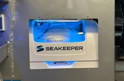 Slide: The Image of Seakeeper stabilizer installed on 2023 Extreme Boats 745 Game King, illuminated with blue light. - 34