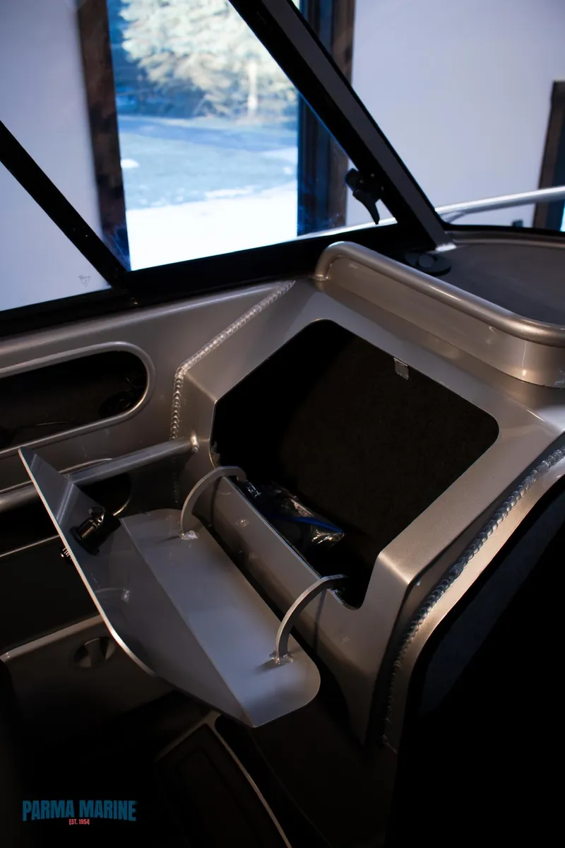 Slide: The Image of 2023 Extreme Boats 745 Game King interior with open storage compartment. - 39